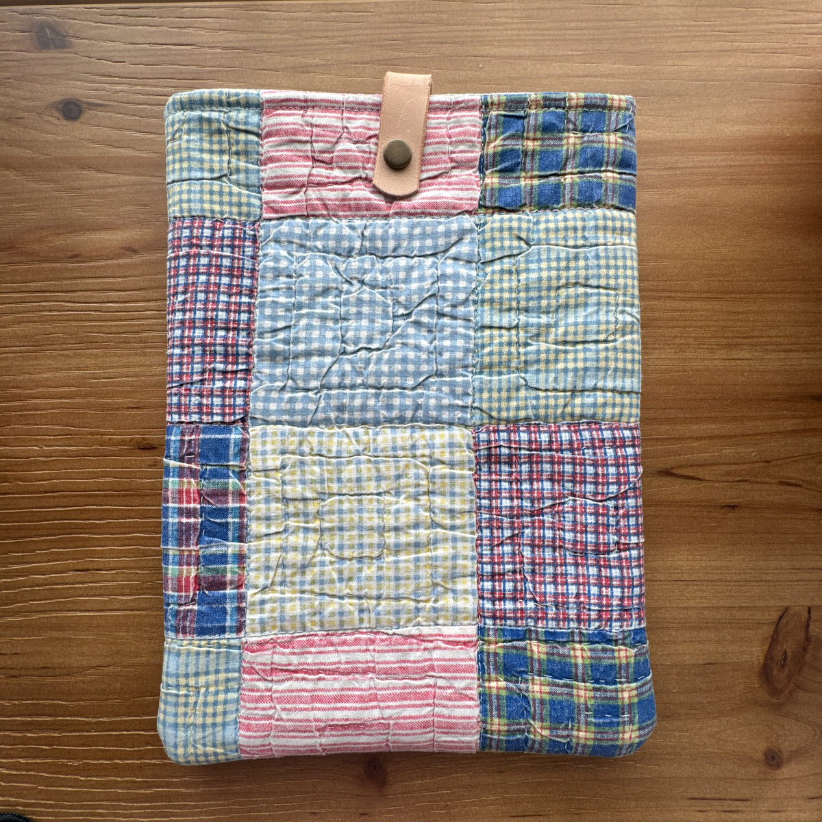 One-of-a-kind rescued vintage quilt book and iPad sleeve with vegetable-tanned leather snap closure.