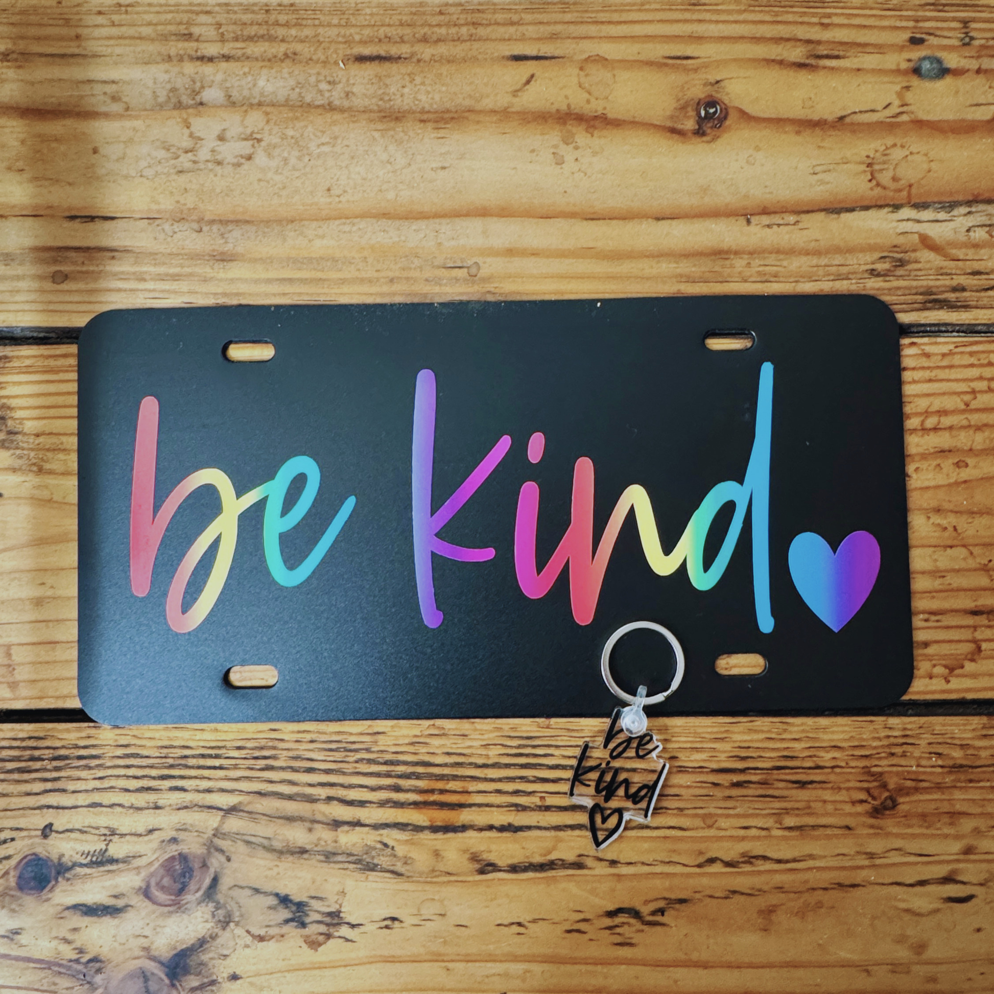 black license plate with be kind writing and coordinating acrylic keychain