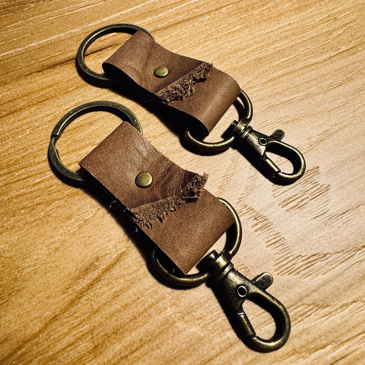 Raw Edge Brown minimalist leather keychain with antique brass hardware